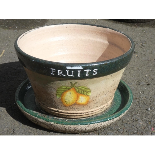 131 - A pottery 'Fruit' plant pot and saucer.