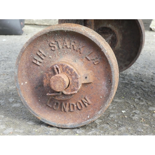 174 - An antique H H Stark Limited, London hand truck and an antique cobblers shoe last.