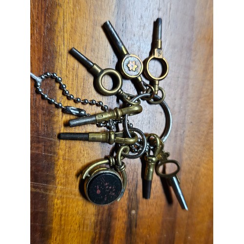 214 - A collection of vintage/ antique pocket watch keys.