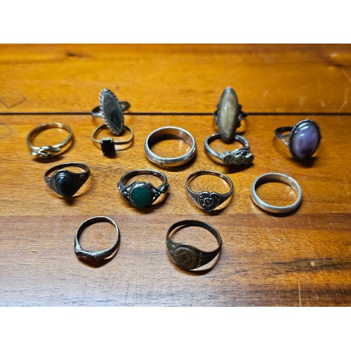 219 - A collection of 13 vintage silver rings.