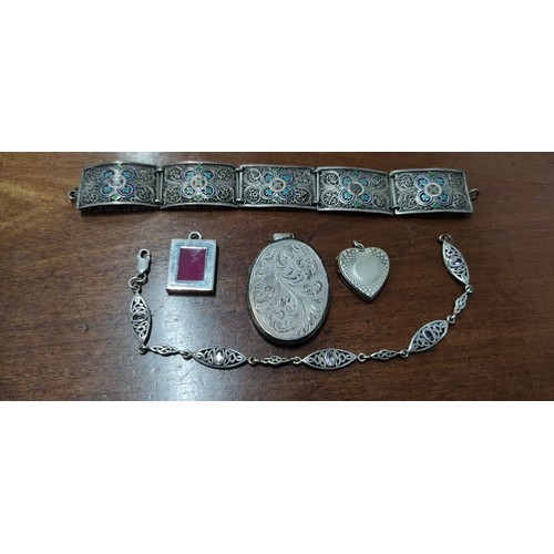 228 - A large Sterling Silver locket & more.