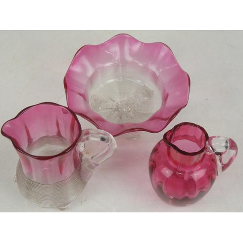 32 - A stunning antique ruby ribbed glass jug and sugar bowl and another ruby jug (a/f).