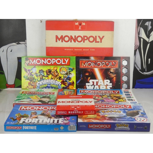 47 - A lot of Monopoly board games.