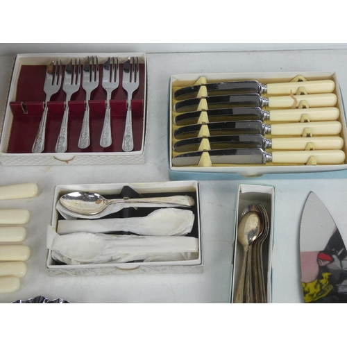 63 - A large lot of assorted vintage cutlery, including a set of six Mutual knives, boxed sets etc.