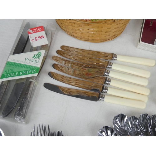 63 - A large lot of assorted vintage cutlery, including a set of six Mutual knives, boxed sets etc.