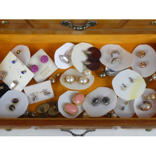 76 - A wooden jewellery box with a lot of assorted costume jewellery, earrings etc.