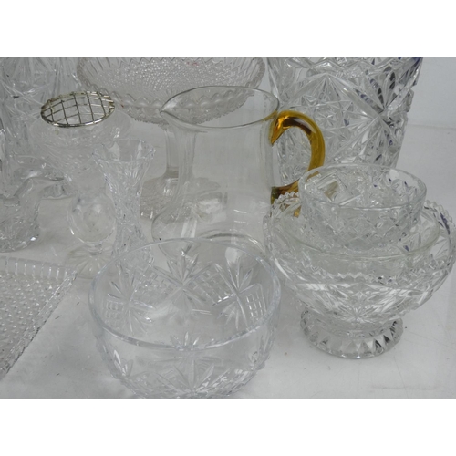 83 - A glass water jug with amber handle and a large lot of other glass ware.