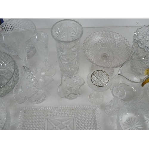 83 - A glass water jug with amber handle and a large lot of other glass ware.