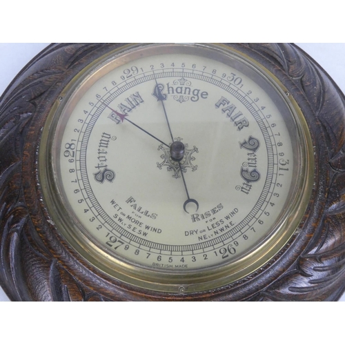 87 - An antique oak cased barometer, measuring 10.5