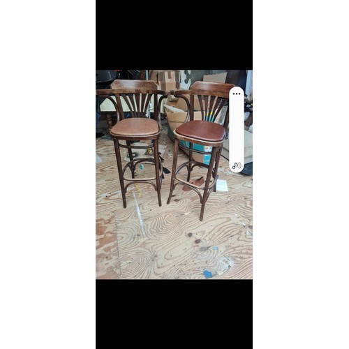 143 - A pair of high backed bar stools.