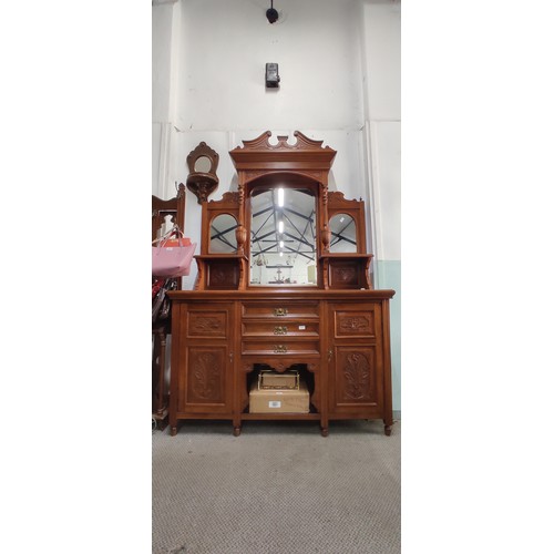 303 - A stunning antique sideboard with mirror back and carved panels, measuring 150cm.