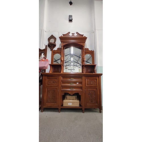 303 - A stunning antique sideboard with mirror back and carved panels, measuring 150cm.