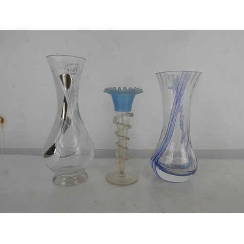 19 - An antique glass bud vase with blue ribbed detail and two other glass vases.