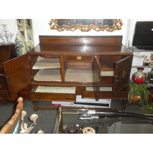 34 - A stunning antique oak sideboard with decorative peacock design panel doors and two drawers, measuri... 