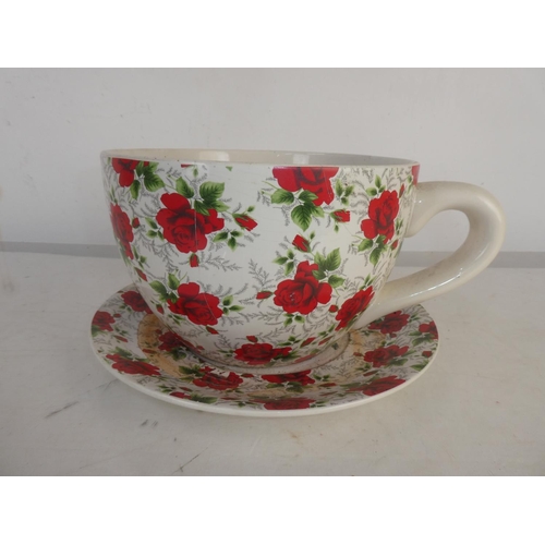 93 - A large ceramic cup and saucer planter.