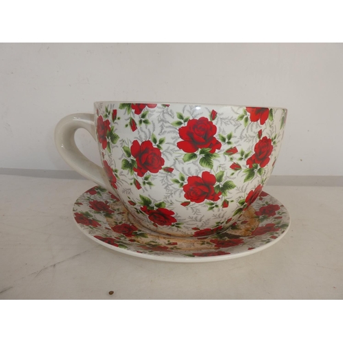 93 - A large ceramic cup and saucer planter.