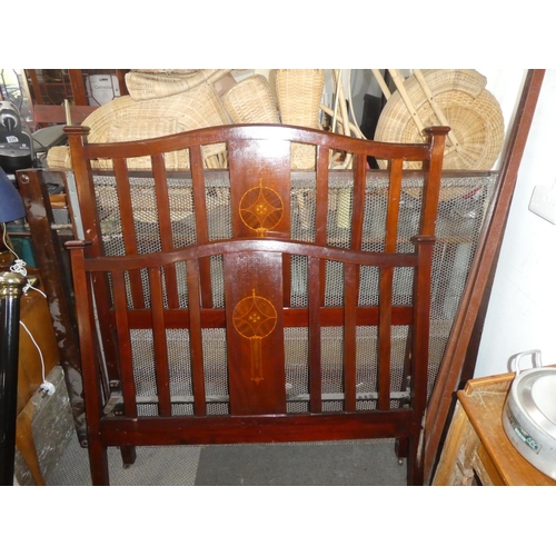 94 - An antique mahogany double bed frame with inlay detail.