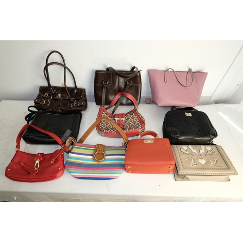 299 - A large collection of assorted handbags.