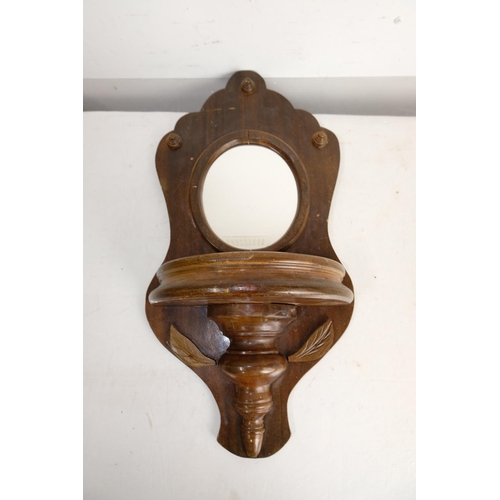 304 - A vintage oak wall bracket with mirror.