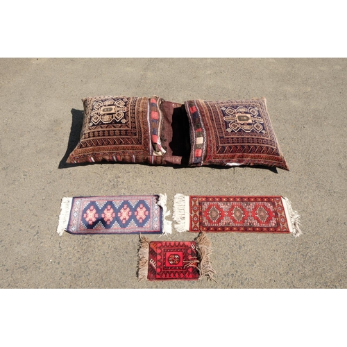 319 - Two large cushions and three prayer mats.