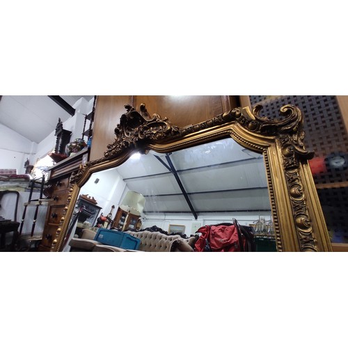 329 - A stunning large gilt framed mirror, measuring 52