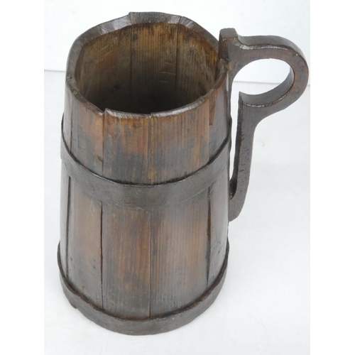 29 - An early 19th century wooden tankard.