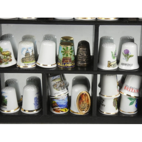 103 - A cased set of collectors thimbles.