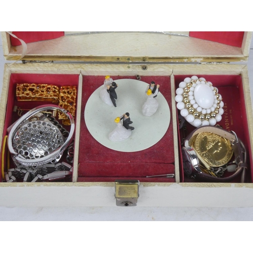 112 - A vintage jewellery box and contents.