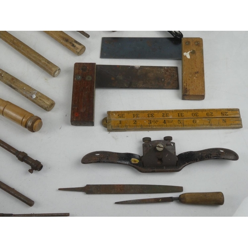 120 - A lot of vintage tools to include an oil can, rulers etc.