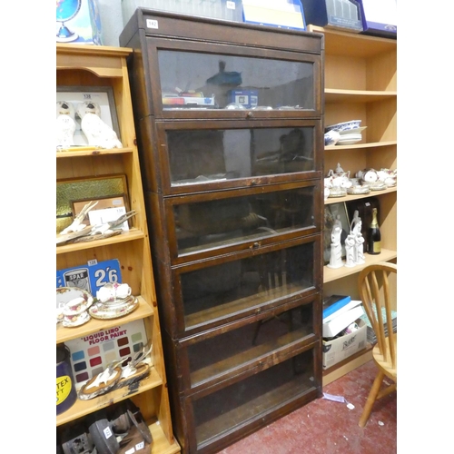 142 - A stunning vintage 6 tier stacking barrister bookcase.