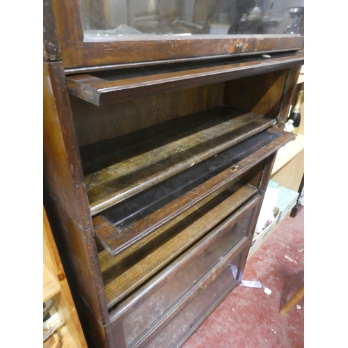 142 - A stunning vintage 6 tier stacking barrister bookcase.