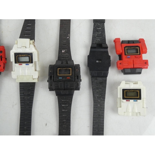 143 - An assortment of retro 'Transformer' watches.