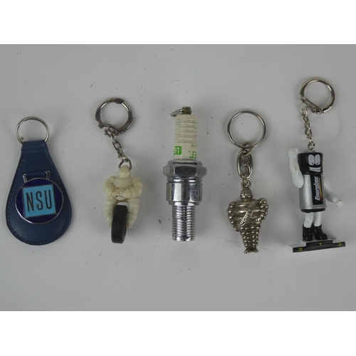 163 - A collection of vintage advertising keyrings etc.