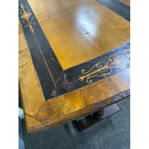 An antique/ Victorian library table, in need of some light restoration.