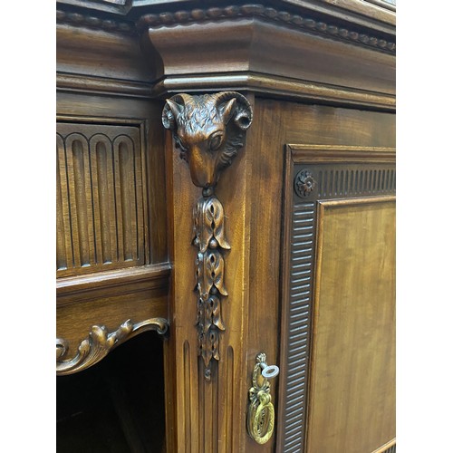 328 - A stunning Irish Georgian style mahogany sideboard on eight claw and ball feet, each foot supported ... 