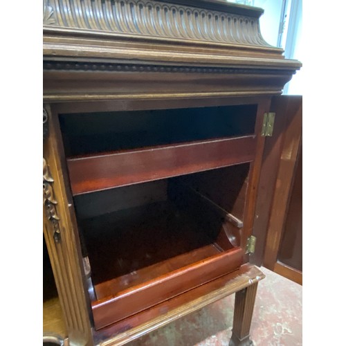 328 - A stunning Irish Georgian style mahogany sideboard on eight claw and ball feet, each foot supported ... 