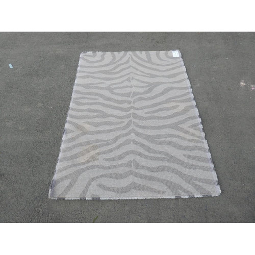 209 - A large Zebra print rug.