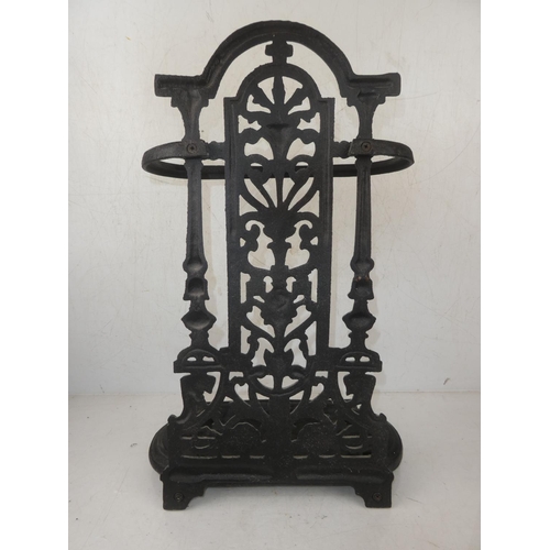 216 - A small antique cast iron umbrella stand.