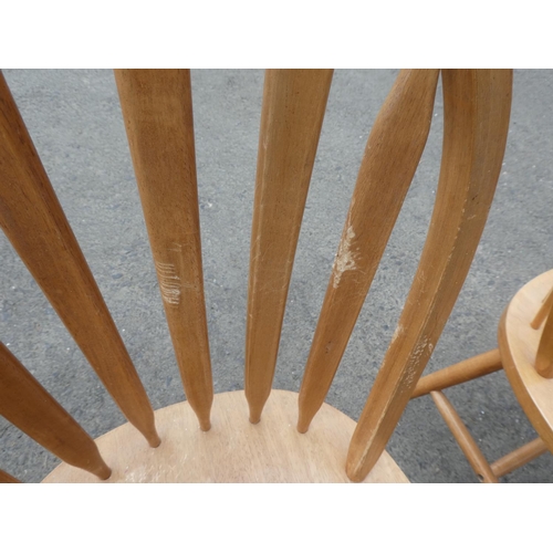 242 - A set of three pine kitchen chairs.