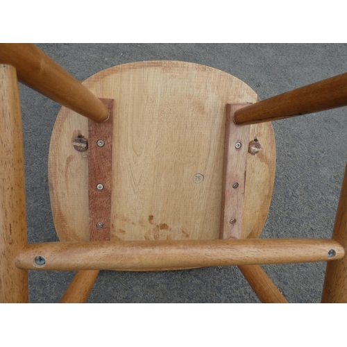 242 - A set of three pine kitchen chairs.