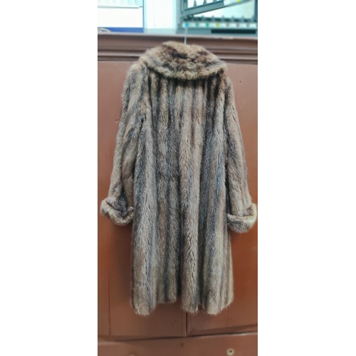 250 - A vintage fur coat with label M Soble, Direct Furriers, Belfast.