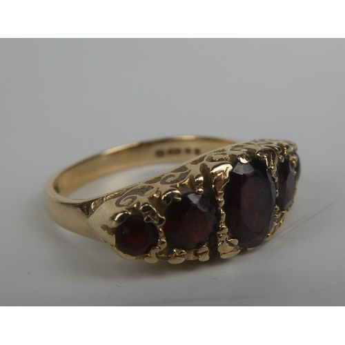 279 - A stunning 9ct gold and five ruby stone ring.