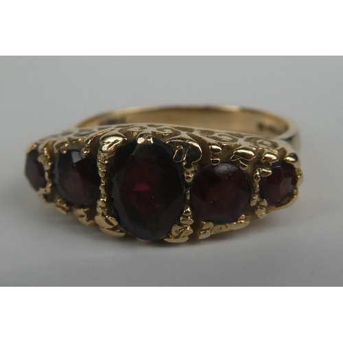 279 - A stunning 9ct gold and five ruby stone ring.