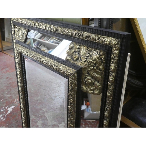 331 - A stunning French brass and ebony framed wall mirror, measuring 72cm x 84cm.