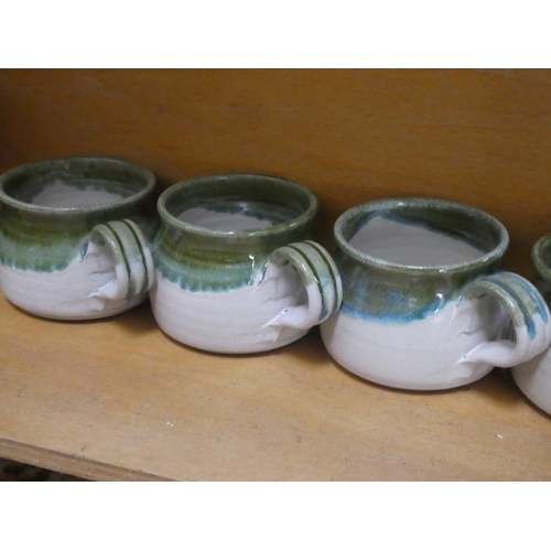 358 - A Studio pottery coffee pot, milk jug (a/f) and sugar bowl, six cups and a water pot.