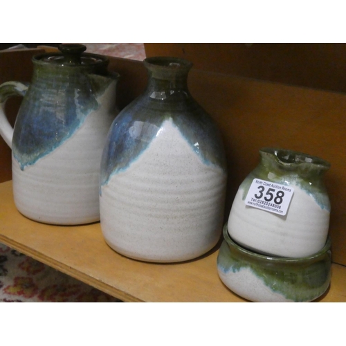 358 - A Studio pottery coffee pot, milk jug (a/f) and sugar bowl, six cups and a water pot.