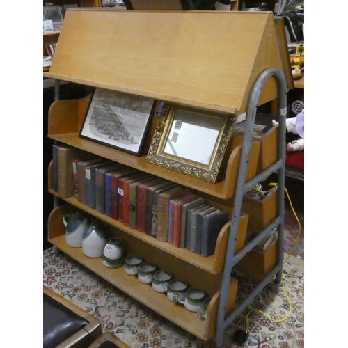 374 - A vintage double sided library bookstand/trolley.