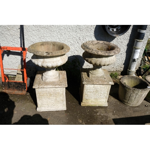 420 - A pair of concrete Urn pedestal planters.