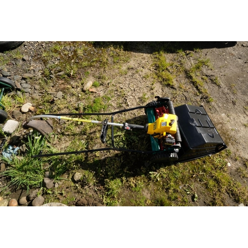 422 - A seed spreader and a McCulloch TrimMac 210 strimmer.