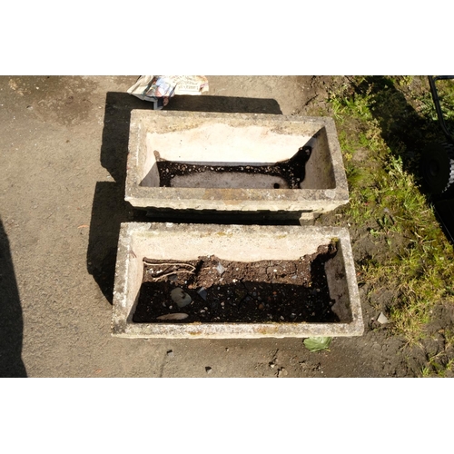 423 - A pair of long concrete planters with Art Nouveau motif.